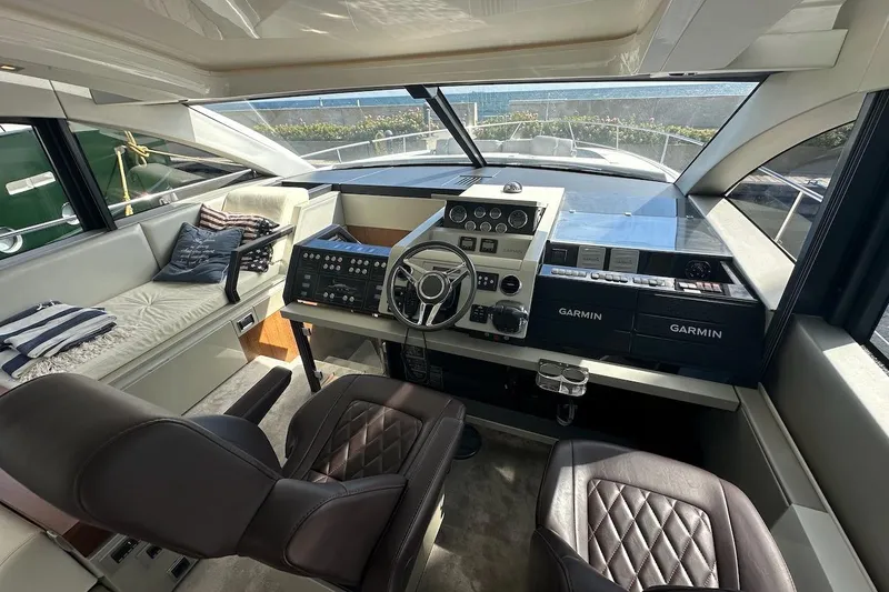 Three Bears Yacht Photos Pics Luxurious 2012 Fairline Targa 58 yacht cockpit with modern Garmin navigation systems.