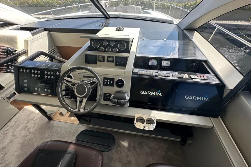 Three Bears Yacht Photos Pics Cockpit of 2012 Fairline Targa 58 yacht with Garmin navigation systems.