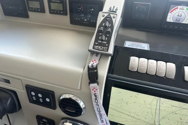 Three Bears Yacht Photos Pics Control panel of 2012 Fairline Targa 58 yacht with Yacht Controller and navigation display.