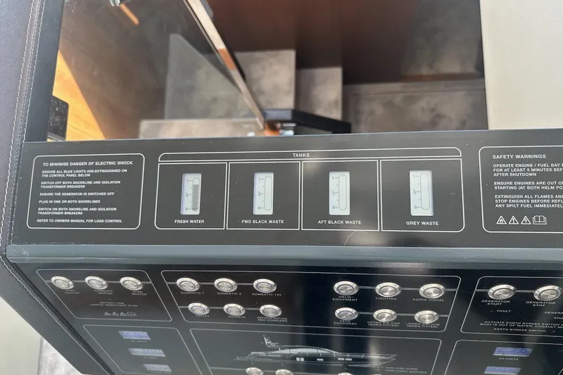 Three Bears Yacht Photos Pics Control panel of a 2012 Fairline Targa 58 yacht, displaying tank levels and safety warnings.