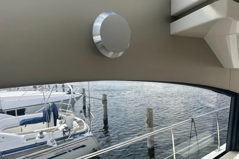 Three Bears Yacht Photos Pics Interior view from 2012 Fairline Targa 58 yacht, overlooking marina with boats.