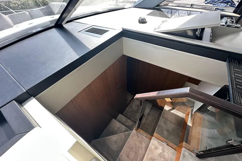 Three Bears Yacht Photos Pics Interior stairs of 2012 Fairline Targa 58 yacht, featuring sleek design and modern materials.