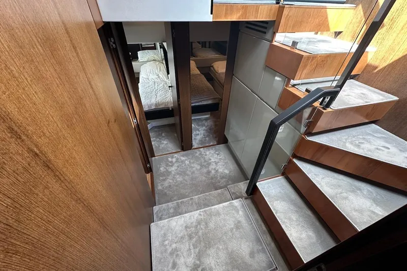 Three Bears Yacht Photos Pics Interior of 2012 Fairline Targa 58 yacht with modern staircase and cozy bedrooms.