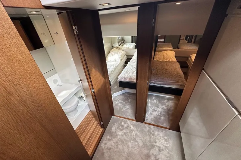 Three Bears Yacht Photos Pics Luxurious interior of 2012 Fairline Targa 58 yacht with bedroom and bathroom.