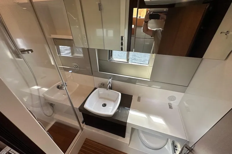 Three Bears Yacht Photos Pics Luxurious bathroom interior of 2012 Fairline Targa 58 yacht with modern fixtures.