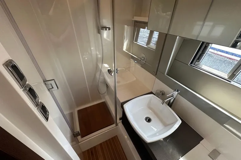 Three Bears Yacht Photos Pics Luxurious bathroom in 2012 Fairline Targa 58 yacht with modern fixtures and sleek design.