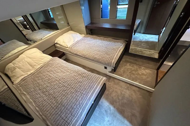 Three Bears Yacht Photos Pics Luxurious twin bedroom in 2012 Fairline Targa 58 yacht, featuring modern design and cozy bedding.