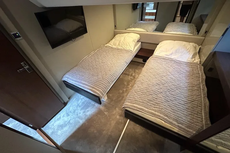 Three Bears Yacht Photos Pics Interior of 2012 Fairline Targa 58 yacht with twin beds and modern decor.