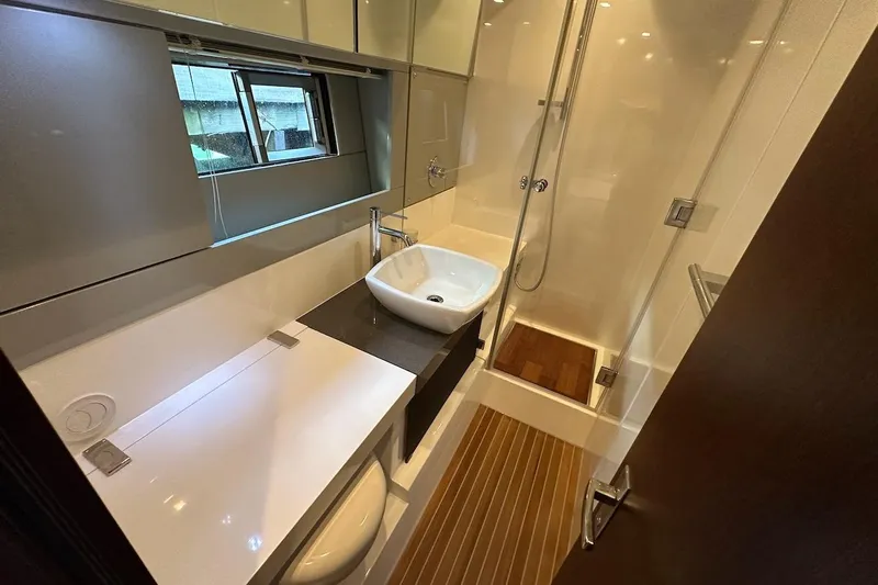 Three Bears Yacht Photos Pics Luxurious bathroom in 2012 Fairline Targa 58 yacht with modern fixtures and shower.