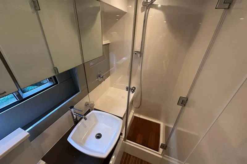 Three Bears Yacht Photos Pics Luxurious bathroom in 2012 Fairline Targa 58 yacht with modern fixtures and shower.