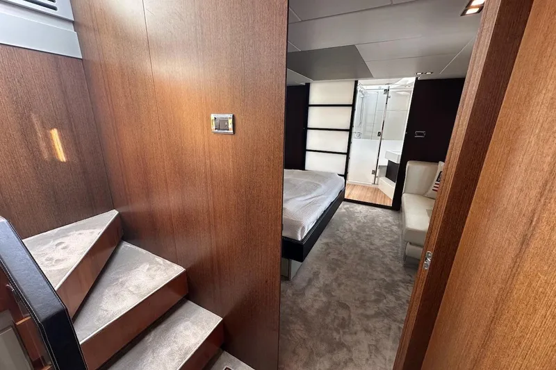 Three Bears Yacht Photos Pics Luxurious interior of 2012 Fairline Targa 58 yacht with bedroom and staircase.