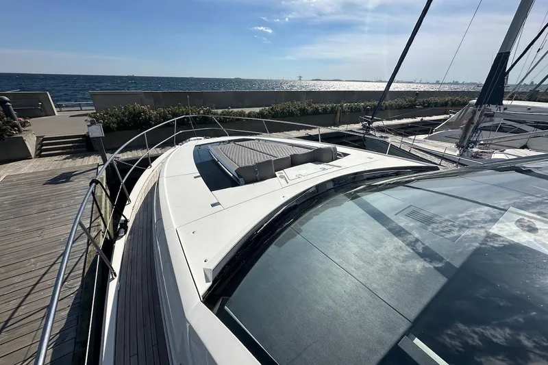 Three Bears Yacht Photos Pics 2012 Fairline Targa 58 yacht docked by the sea under a clear blue sky.