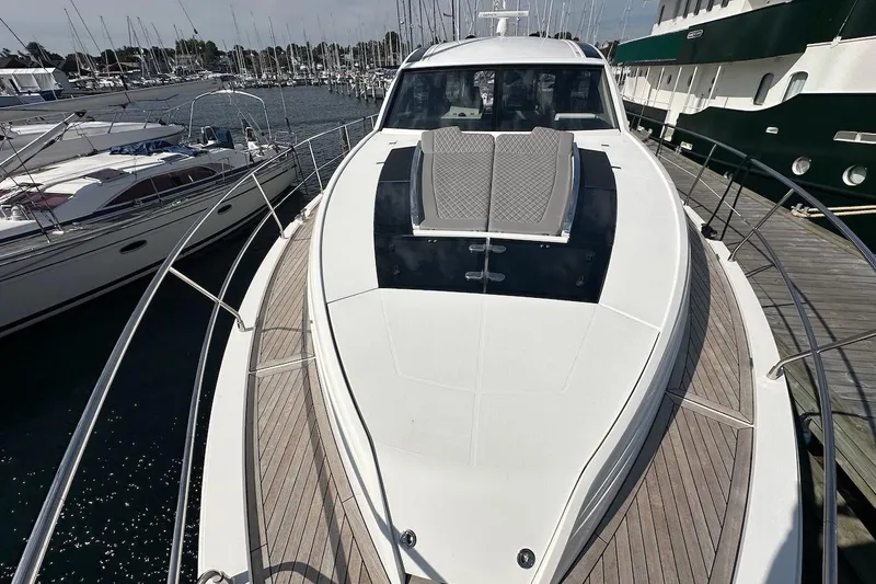 Three Bears Yacht Photos Pics 2012 Fairline Targa 58 yacht docked at marina, showcasing sleek design and spacious deck.