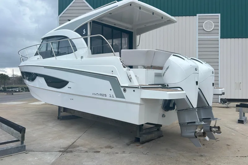  Yacht Photos Pics 2025 Beneteau Antares 11 Coupe boat with dual outboard engines on display.