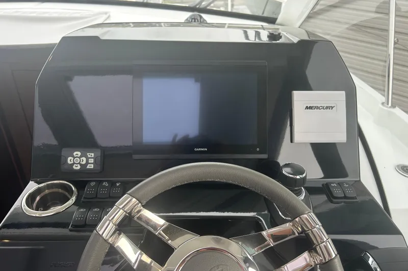  Yacht Photos Pics Dashboard of 2025 Beneteau Antares 11 Coupe with Garmin display and Mercury controls.