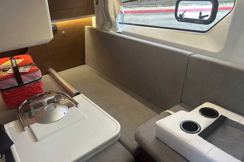  Yacht Photos Pics Interior of 2025 Beneteau Antares 11 Coupe with seating and table setup.