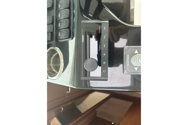  Yacht Photos Pics Control panel of 2025 Beneteau Antares 11 Coupe with joystick and buttons.