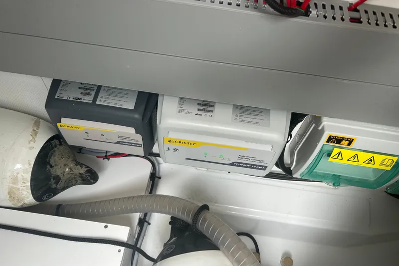  Yacht Photos Pics Battery chargers and electrical components in a 2025 Beneteau Antares 11 Coupe boat.