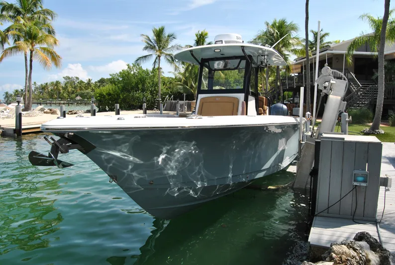  Yacht Photos Pics 2020 Sea Hunt Gamefish 30 boat docked in tropical marina setting.