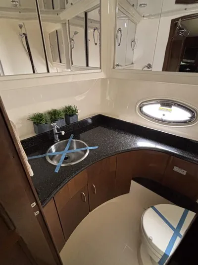 Odyssea II Yacht Photos Pics Luxurious bathroom in 2009 Carver 46 Motor Yacht with modern fixtures and elegant design.