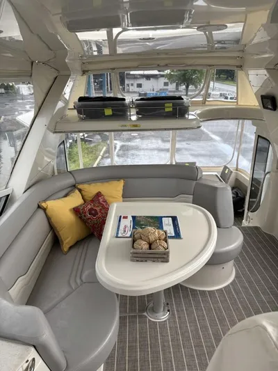 Odyssea II Yacht Photos Pics Interior of 2009 Carver 46 Motor Yacht with cozy seating and decorative pillows.