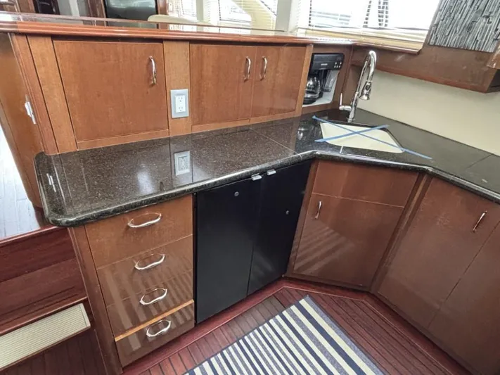 Odyssea II Yacht Photos Pics 2009 Carver 46 Motor Yacht kitchen with wood cabinets and granite countertops.