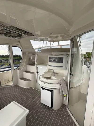 Odyssea II Yacht Photos Pics Interior of 2009 Carver 46 Motor Yacht with sink and steps, featuring modern design.