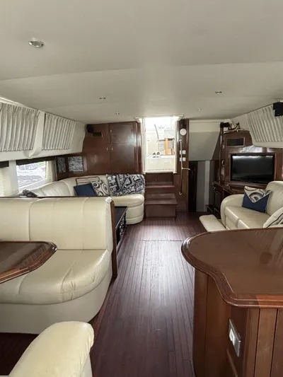 Odyssea II Yacht Photos Pics Luxurious interior of 2009 Carver 46 Motor Yacht with elegant seating and wood finishes.