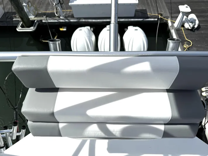  Yacht Photos Pics Albemarle 30 Express 2022 boat seat with dual engines in background at dock.