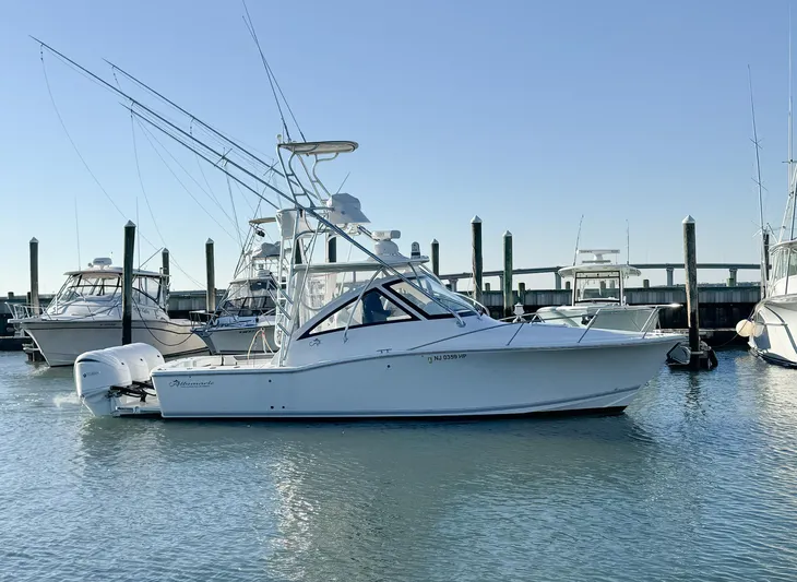  Yacht Photos Pics 2022 Albemarle 30 Express boat docked in marina, clear sky background.