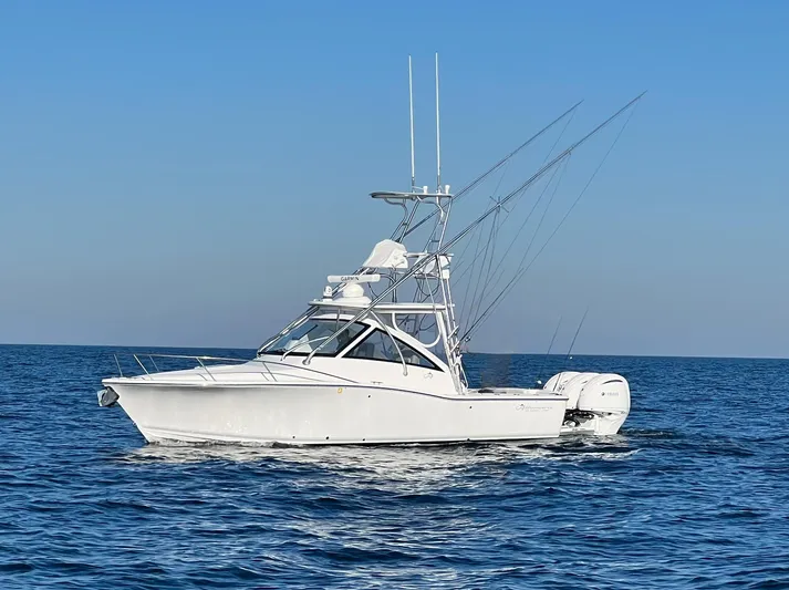  Yacht Photos Pics 2022 Albemarle 30 Express boat on open sea under clear blue sky.