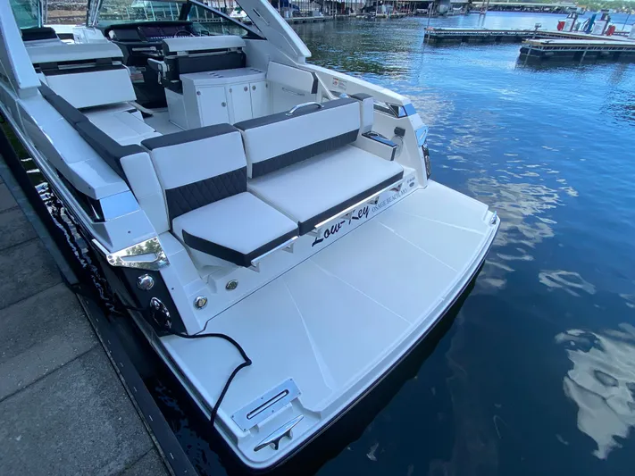  Yacht Photos Pics 2022 Monterey 378SS boat with sleek seating and swim platform by the water.