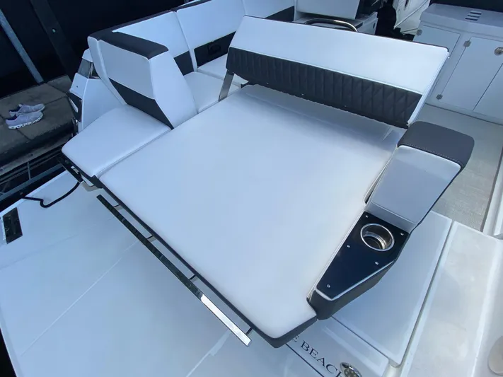  Yacht Photos Pics 2022 Monterey 378SS boat interior with white seating and cup holder.