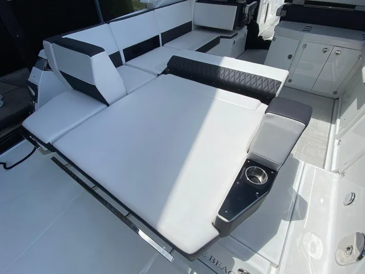  Yacht Photos Pics 2022 Monterey 378SS boat interior with white seating and cup holder.