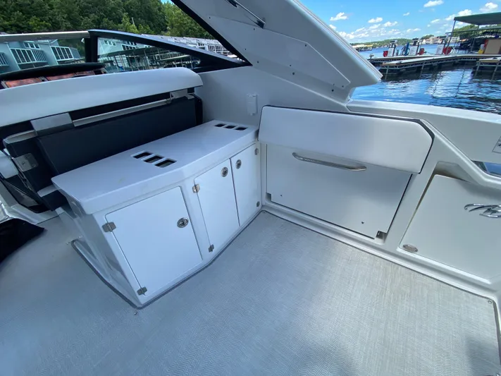  Yacht Photos Pics 2022 Monterey 378SS boat interior with storage cabinets and lake view.