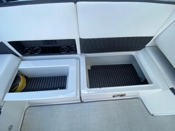  Yacht Photos Pics 2022 Monterey 378SS boat interior with storage compartments and cup holders.