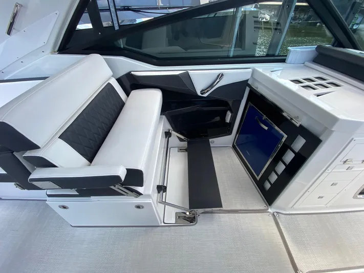  Yacht Photos Pics 2022 Monterey 378SS boat interior with white seating and modern control panel.