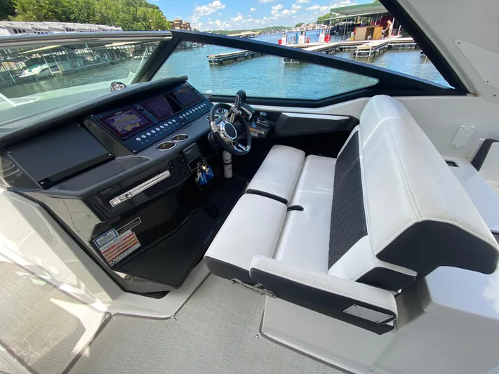  Yacht Photos Pics 2022 Monterey 378SS boat cockpit with modern dashboard and comfortable seating.