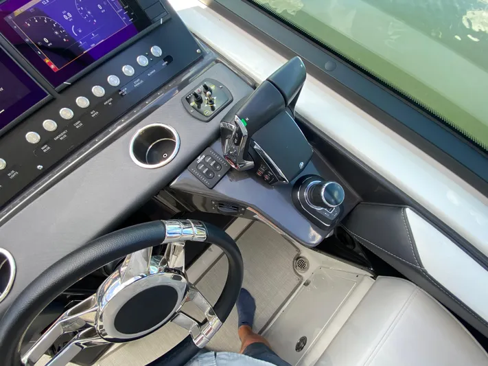  Yacht Photos Pics 2022 Monterey 378SS boat dashboard with steering wheel and control panel.