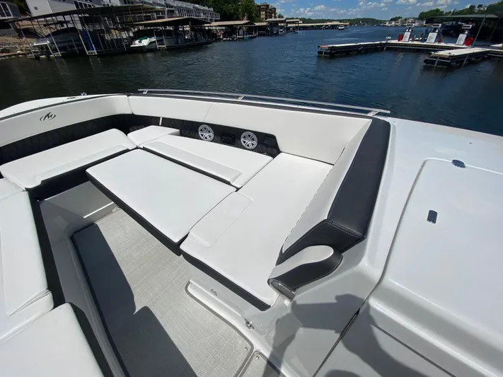  Yacht Photos Pics 2022 Monterey 378SS boat interior with white seating, docked at a marina.