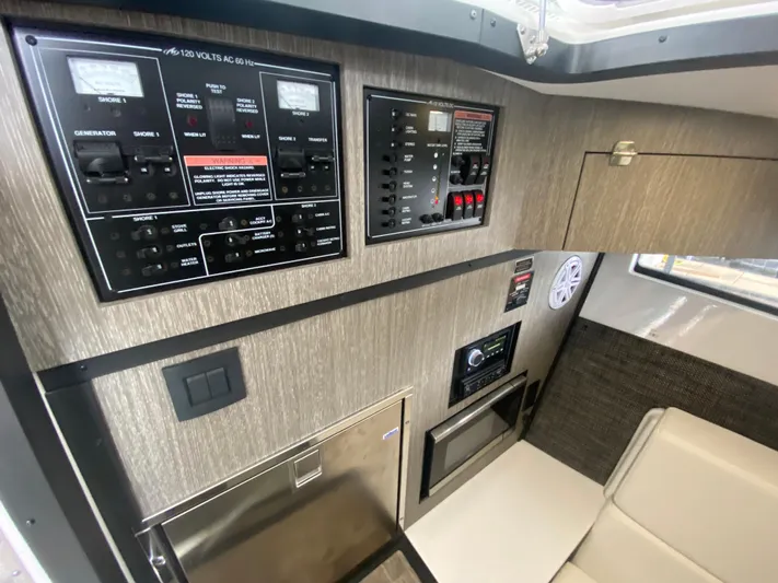  Yacht Photos Pics Control panel and interior of 2022 Monterey 378SS boat, featuring modern amenities.