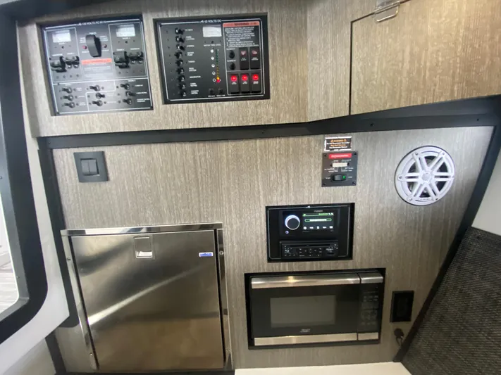  Yacht Photos Pics Control panel and appliances inside a 2022 Monterey 378SS boat cabin.
