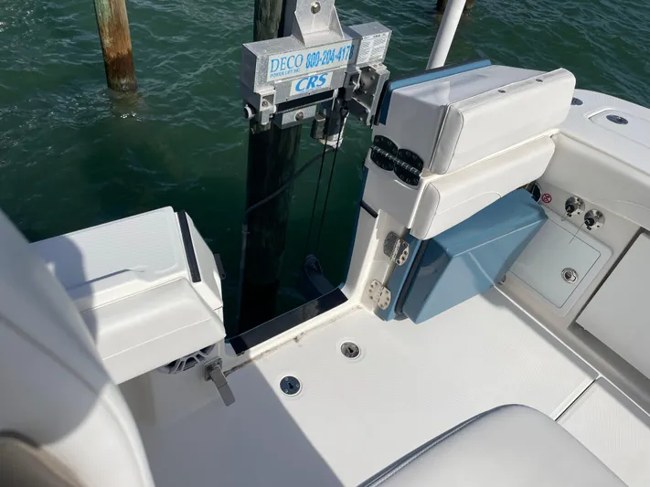  Yacht Photos Pics 2023 Regulator 31 boat interior with seating and water view.