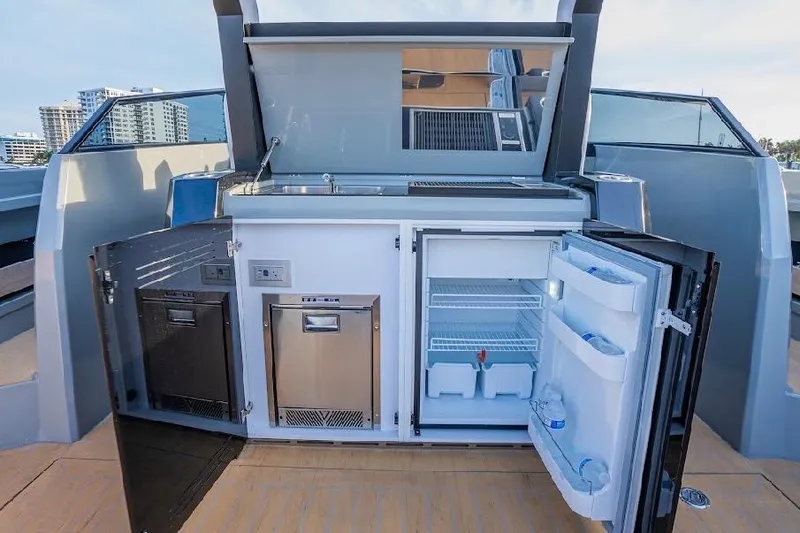  Yacht Photos Pics 2024 Rio Yachts Daytona 50 outdoor kitchen with fridge and storage compartments.
