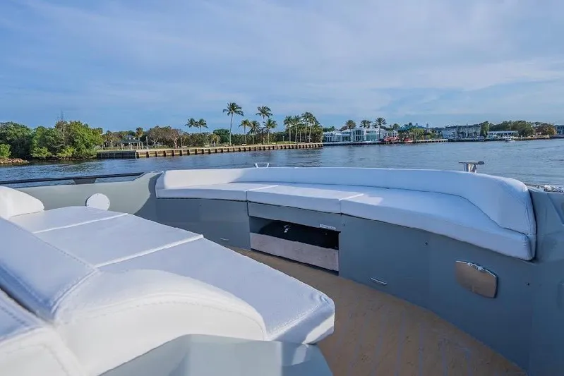  Yacht Photos Pics 2024 Rio Yachts Daytona 50 luxury deck with waterfront view and palm trees.