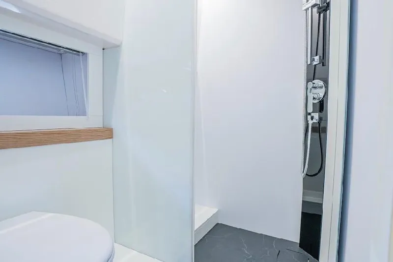  Yacht Photos Pics Modern bathroom interior on 2024 Rio Yachts Daytona 50, featuring sleek shower and minimalist design.