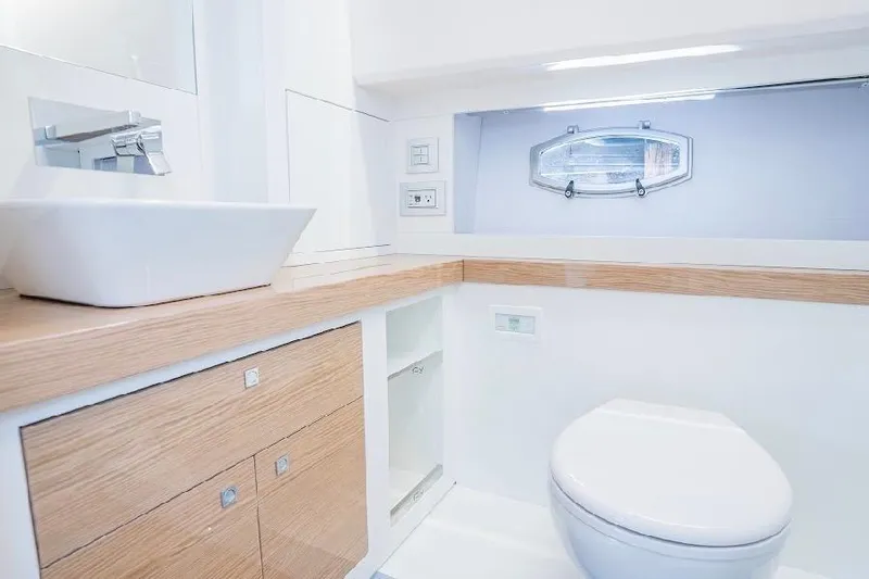 Yacht Photos Pics Luxurious bathroom in 2024 Rio Yachts Daytona 50, featuring modern fixtures and elegant design.