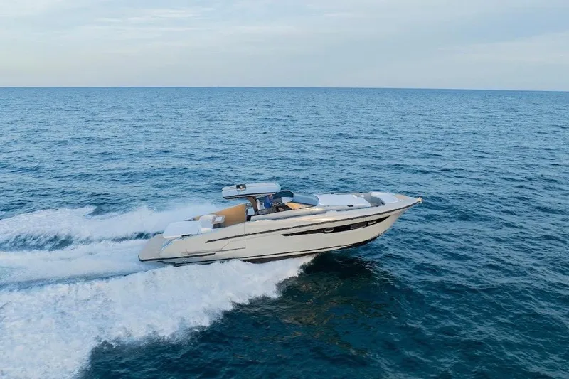  Yacht Photos Pics 2024 Rio Yachts Daytona 50 cruising on open sea, showcasing sleek design and performance.