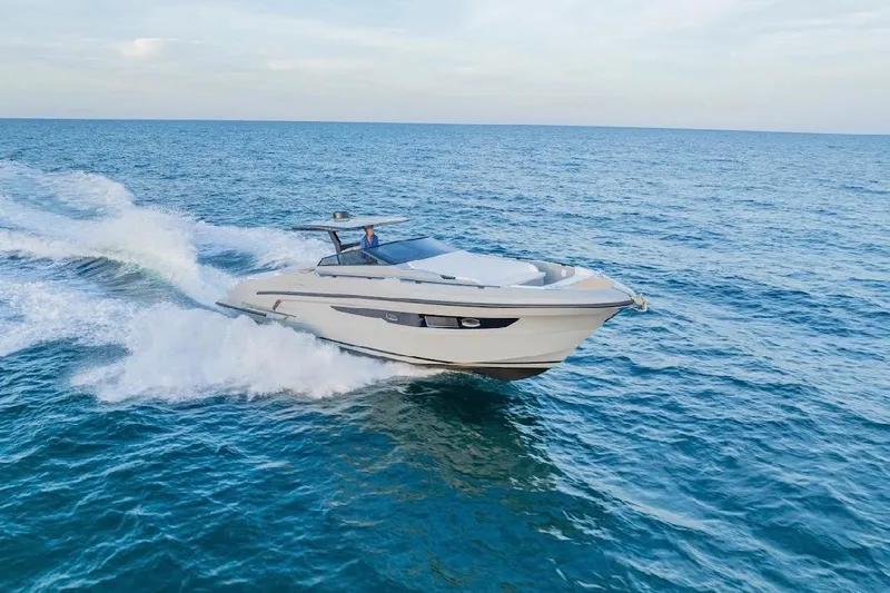  Yacht Photos Pics 2024 Rio Yachts Daytona 50 cruising on open sea, showcasing sleek design and performance.