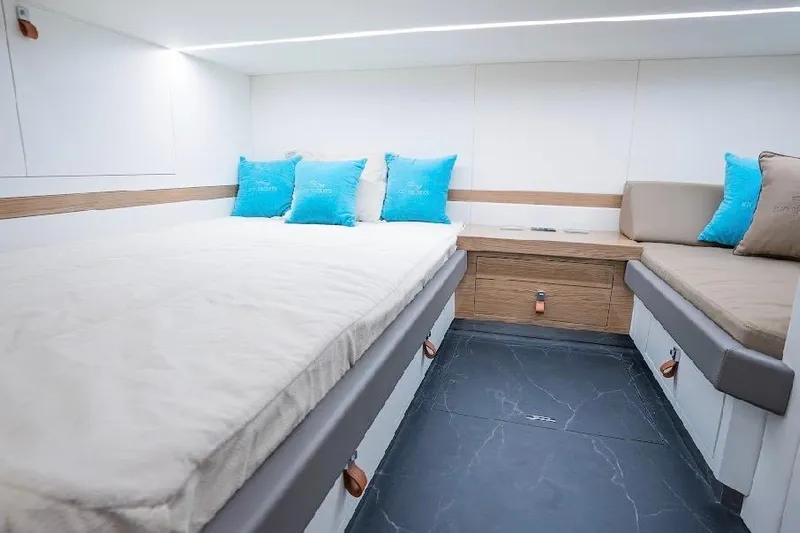  Yacht Photos Pics Luxurious interior cabin of 2024 Rio Yachts Daytona 50 with modern bedding.